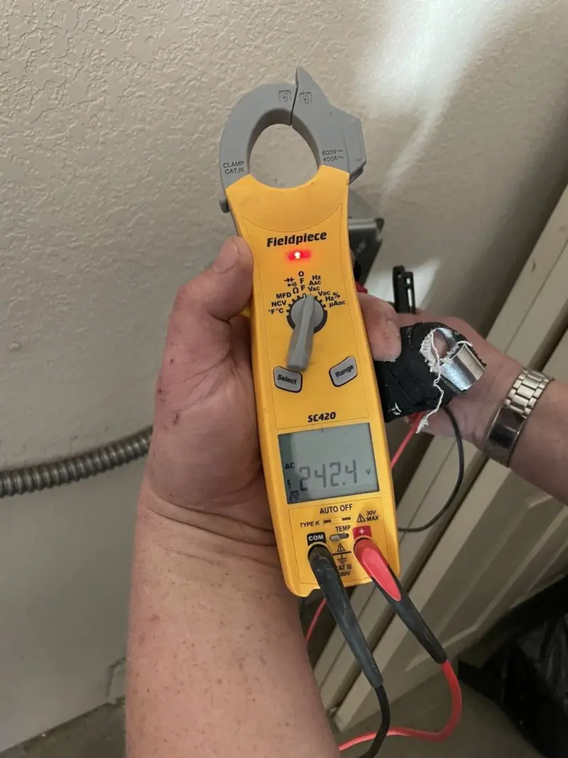 Voltage testing with clamp meter during Outlet Installation in Homer Glen